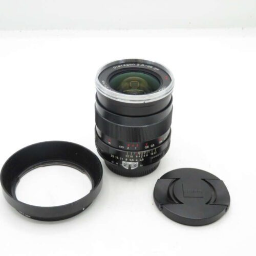 Camera lens with a lens hood and lens cap on a white background.