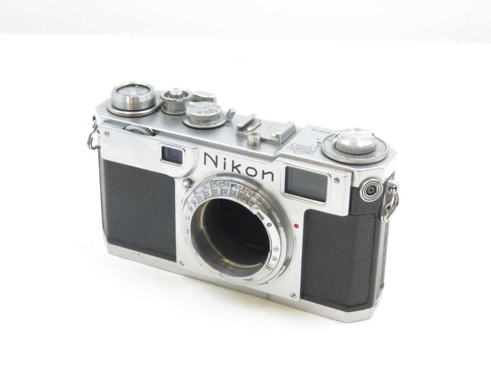 IMG_0789 Vintage Nikon rangefinder camera with a silver metallic body and black leather grip.