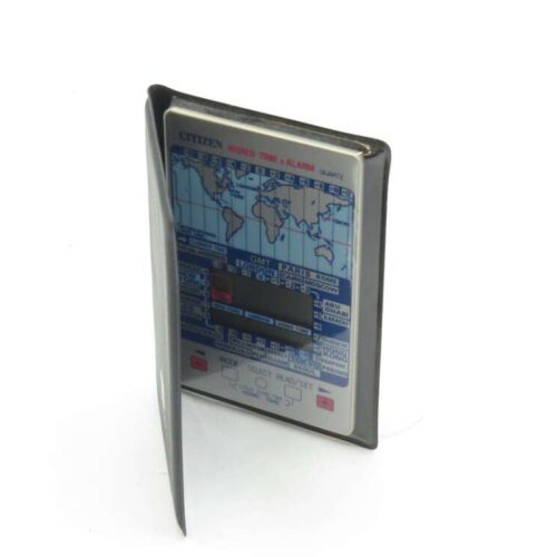 Vintage Citizen World Time and Alarm digital travel clock with a map of global time zones.