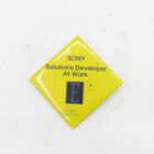 Yellow diamond-shaped badge with the text "SONY Solutions Developer At Work" above a logo that says "SONY ELECTRONIC PHOTOGRAPHY."
