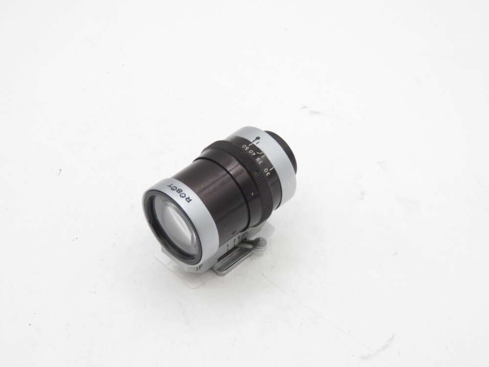 IMG_1320 Black and silver Rodenstock camera lens on a white background.