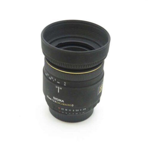 Black Sigma 50mm f/2.8 DG Macro lens with yellow highlight around the barrel.