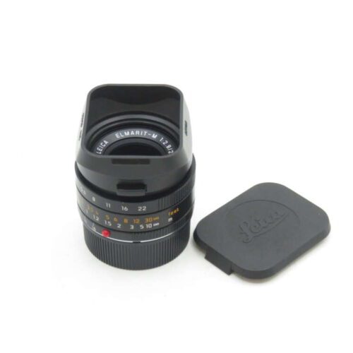 Leica Elmarit-M 1:2.8/21 camera lens with lens cap.