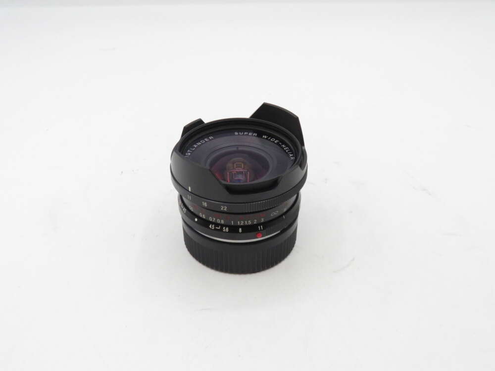 IMG_1731 Voigtlander Super Wide-Heliar camera lens on a white surface.