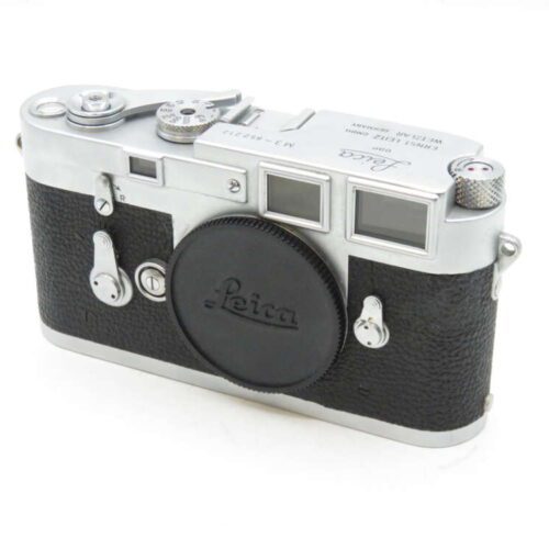 Vintage Leica rangefinder camera with silver and black body.