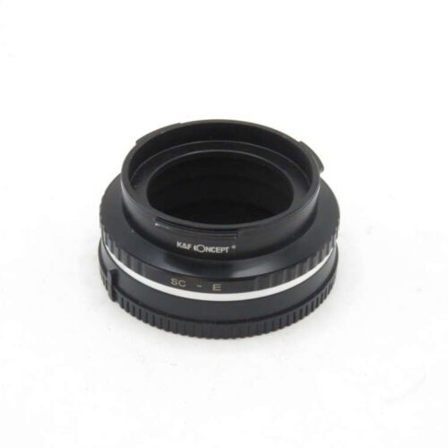 Black camera lens adapter on a white background.