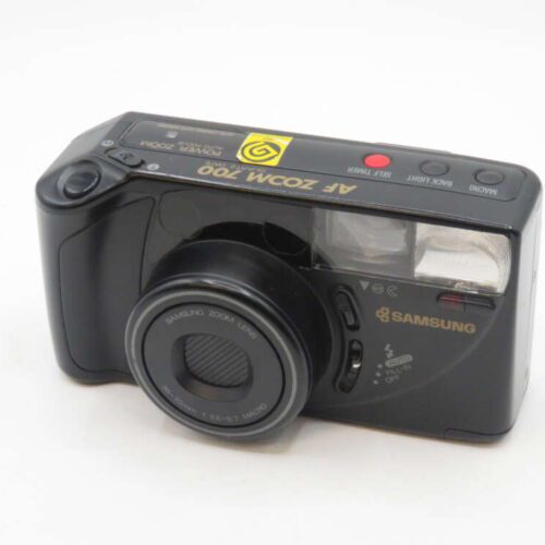 Black Samsung film camera with a zoom lens and built-in flash.