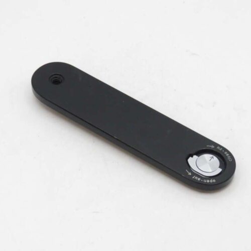 Black rectangular lever with a circular button and arrow symbols indicating open and close directions.