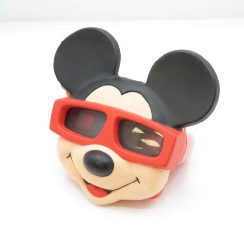 A Mickey Mouse toy wearing red 3D glasses.