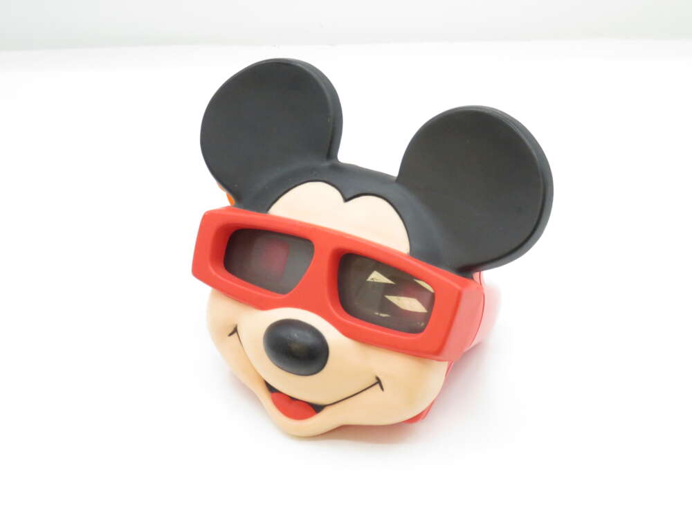 IMG_2919 A Mickey Mouse toy wearing red 3D glasses.
