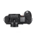 Top view of a black Leica camera showing the control dials, LCD screen, and top plate details.