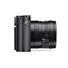 Side view of a black digital camera with a textured grip and lens.