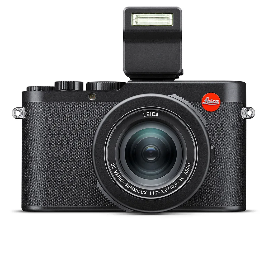 A black Leica camera with a pop-up flash and a textured grip.