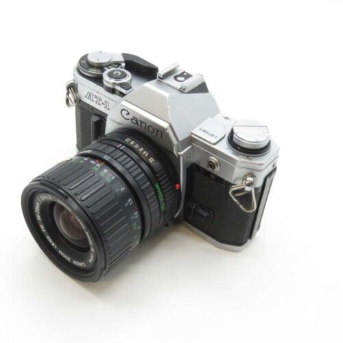 A vintage Canon AT-1 film camera with a Canon FD 28mm lens.