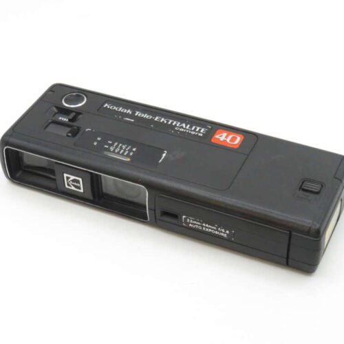 A Kodak Tele-Ektralite 40 camera in black with manual controls and a compact design.