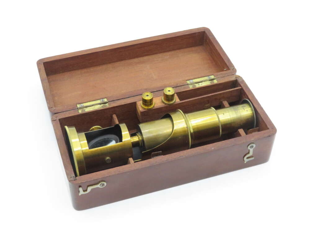 IMG_2995 Brass telescope in a wooden case with two smaller cylindrical attachments.