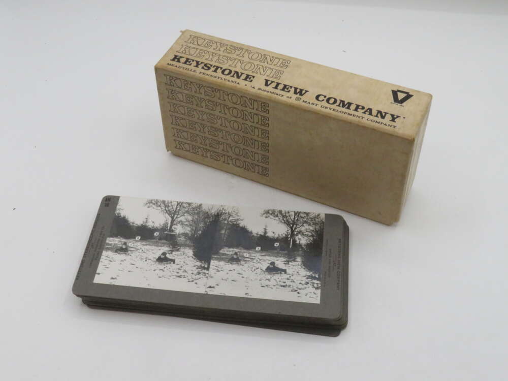 IMG_3005 Box and stack of stereoscope cards from the Keystone View Company, featuring vintage black and white images.