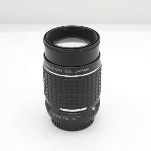 A black Asahi Opt. Co. camera lens with aperture and focus markings.