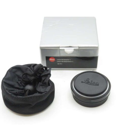 A Leica M-Adapter L with its black protective pouch and box; the adapter has the Leica logo on it.