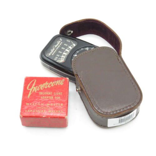A Weston Master II exposure meter in a brown leather case with a red box labeled Invercone, an incident light adapter for exposure meters, sitting beside it.