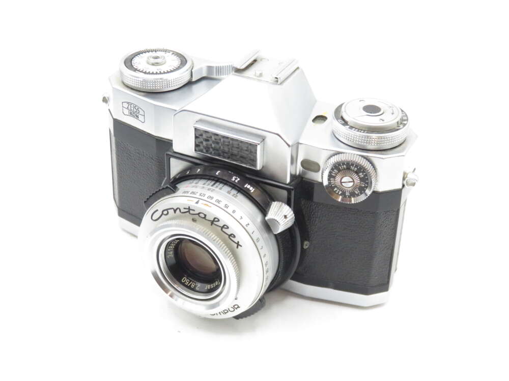 IMG_0170 A vintage Zeiss Ikon Contaflex 35mm film camera featuring a silver and black body with manual controls and a Tessar 2.8/50 lens attached.
