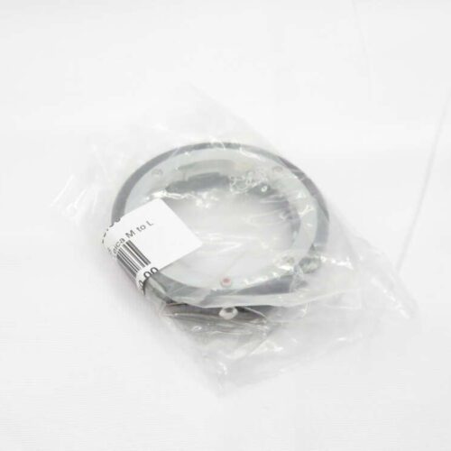 A camera lens adapter ring in a plastic bag with a barcode and label showing 'Leica M to L' on a white background.