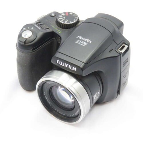 A Fujifilm FinePix S5700 digital camera with a wide-angle lens and various control dials on the top.