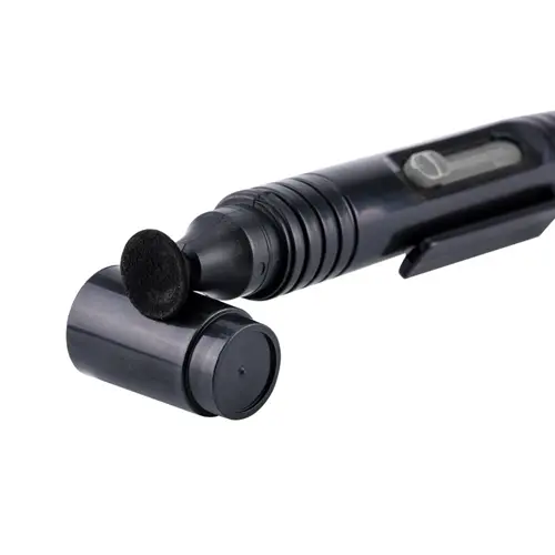 A black lens cleaning pen with a retractable brush and a cap, designed for cleaning camera lenses and optical surfaces.