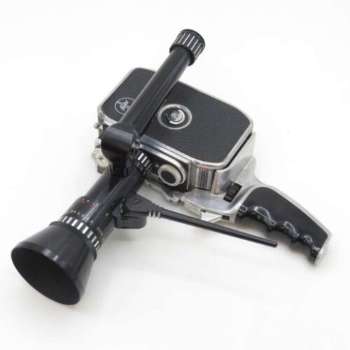 A vintage movie camera with a black matte finish, featuring a long lens and a pistol grip handle, displayed on a white background.