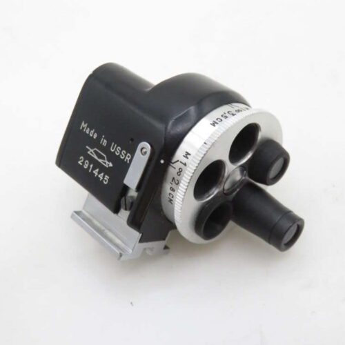 A vintage camera viewfinder labeled 'Made in USSR' with rotating lens dials and a metallic attachment on a white background.
