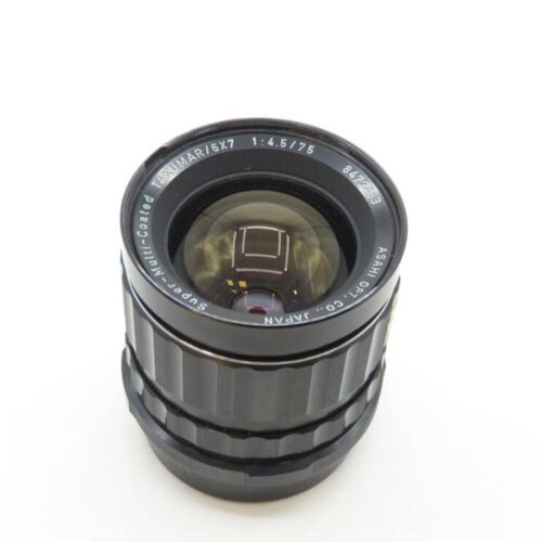 A Super-Multi-Coated Takumar 6x7 1:4.5/75mm camera lens with a metal body, viewed from above on a white background.