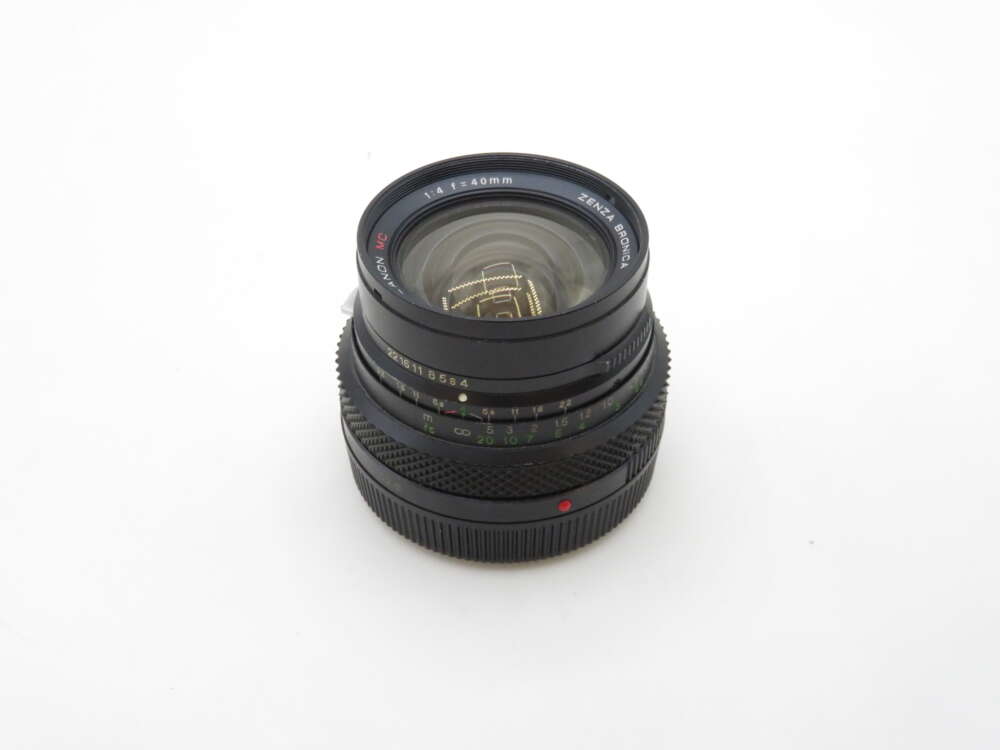 IMG_1081 A Zenza Bronica 40mm f/4 camera lens with focus markings, displayed on a white background.