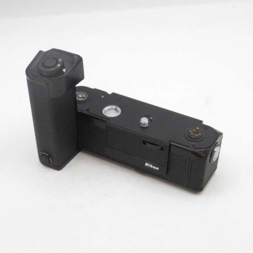A black Nikon camera motor drive with a vertical grip and various control buttons, placed on a white background.