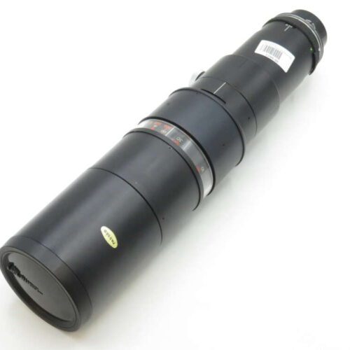 A large, black telephoto camera lens with a zoom ring and distance scale, positioned on a white background.