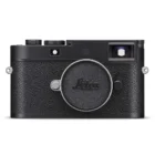 A black Leica camera with a textured body and a lens cap on the front, featuring the Leica logo. The design is minimalist with two knobs on the top and a viewfinder on the right side.