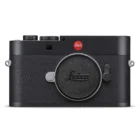 Front view of a Leica camera with a textured black body and a red logo, featuring a round lens cap with the Leica name on it.