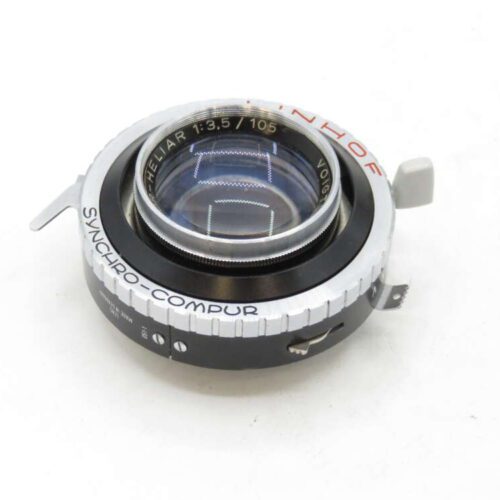 A Voigtländer Heliar 105mm f/3.5 lens featuring a Synchro-Compur shutter, displayed against a white background.