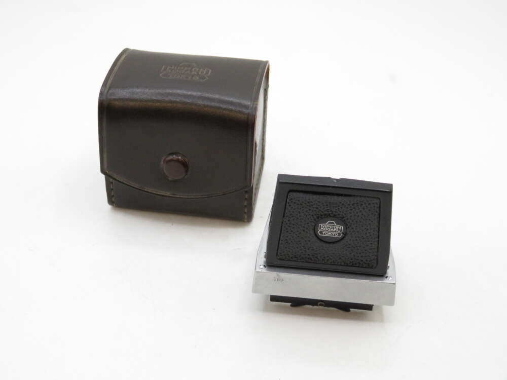 IMG_2328 A camera accessory with a black textured surface, featuring a brand logo in the center, placed next to a matching black leather carrying case with stitching and a button closure.