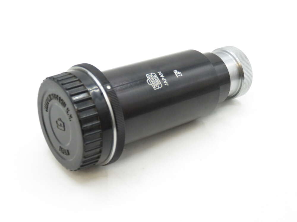 IMG_2348 A Celestron 1.25-inch camera adapter for telescopes, featuring a black cylindrical body with a silver adjustment ring and labelled with 'Japan'.