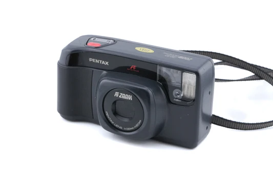24_-_KV7703-1-MN A black Pentax FF Zoom 35mm film camera with a wrist strap attached.