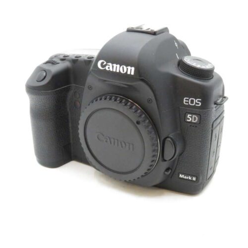 A Canon EOS 5D Mark II DSLR camera with a body cap, viewed from an angle.