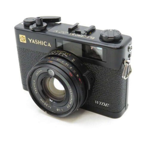 A black Yashica Electro 35 CC camera with a 35mm f/1.8 lens and textured grip.