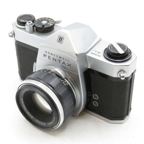 A classic Honeywell Pentax film camera with a silver and black body and a large lens.