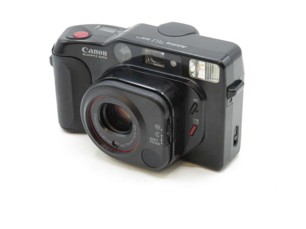 IMG_3181 A black Canon Sure Shot Tele 80 35mm camera with a prominent lens and visible flash.