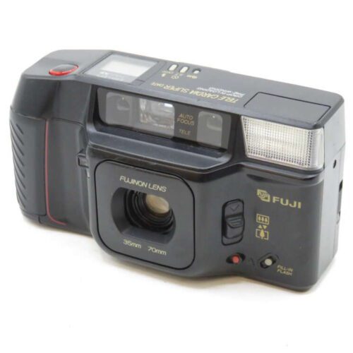 A vintage Fuji camera with a wide lens, flash, and various control buttons.