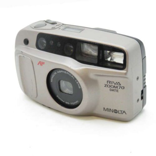 A silver Minolta Riva Zoom 70 date camera with an aspherical lens and compact design.
