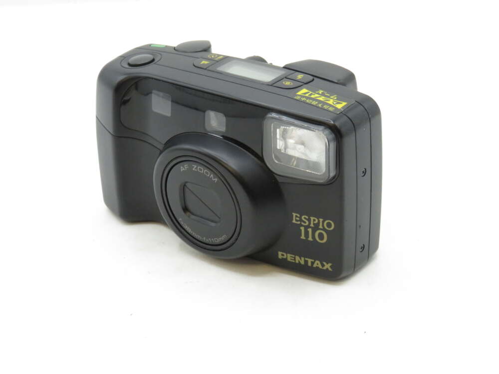 IMG_3224 A black Pentax Espio 110 camera with an AF Zoom lens and built-in flash on a white background.