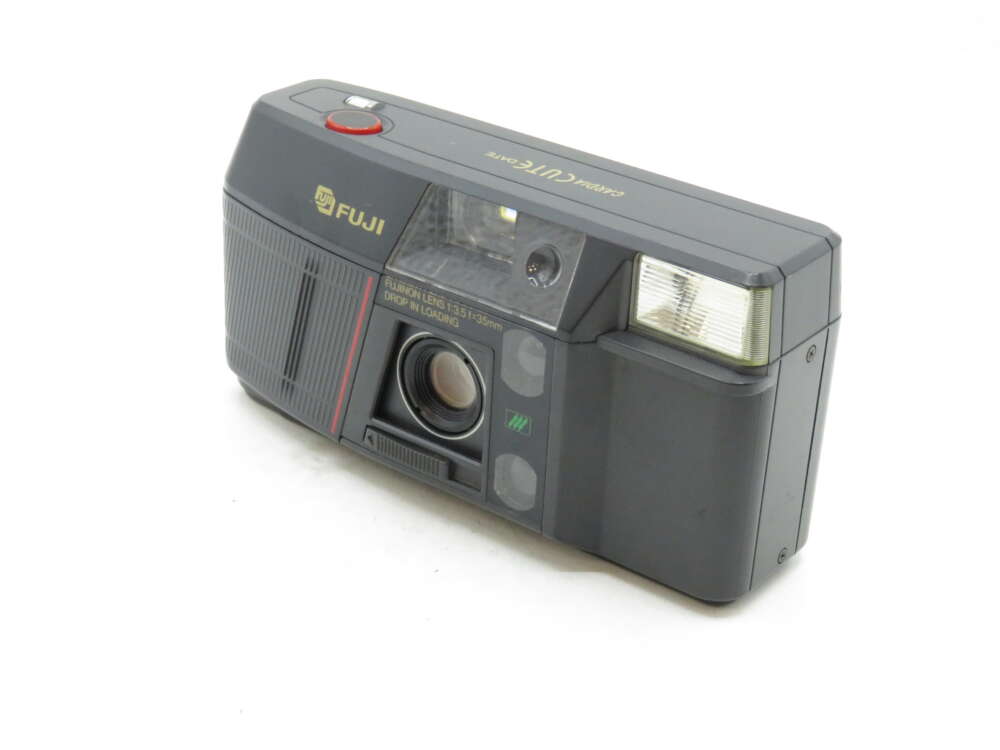 IMG_3239 A vintage Fuji camera with a rectangular design, labelled "Fujix" and featuring a lens and built-in flash.
