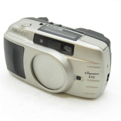 Silver Minolta Capios 125 film camera with a built-in flash and zoom lens.