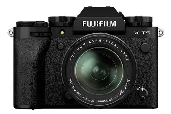 A black Fujifilm X-T5 camera with a large aspherical lens and prominent dials, set against a white background.